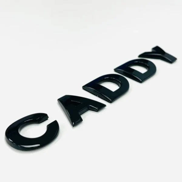 VW Caddy Emblem Blanksvart Logga